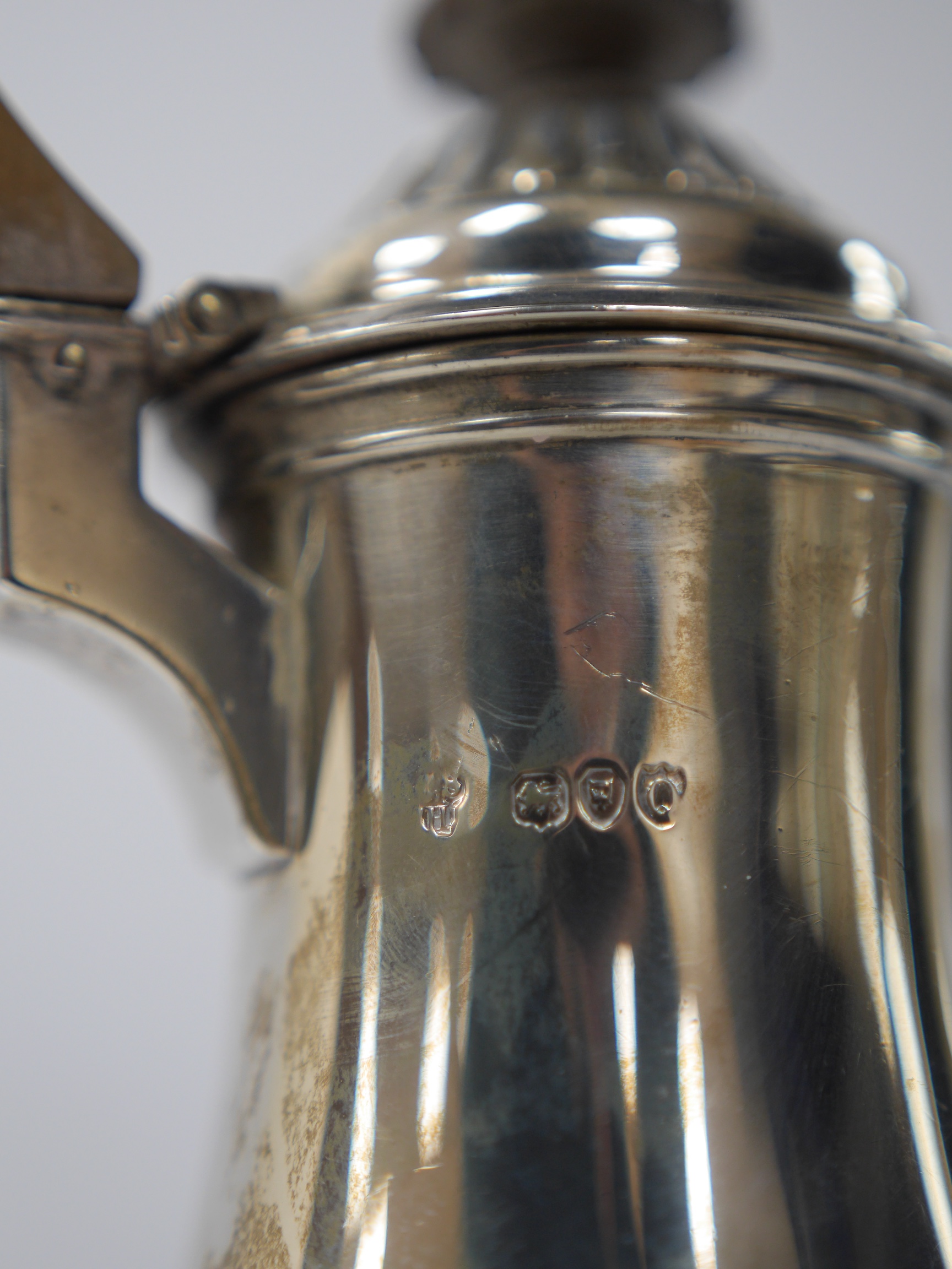 A Victorian demi-fluted silver hot water pot by Charles Stuart Harris, London, 1891, 22.3cm, gross weight 13.4oz. Condition - fair